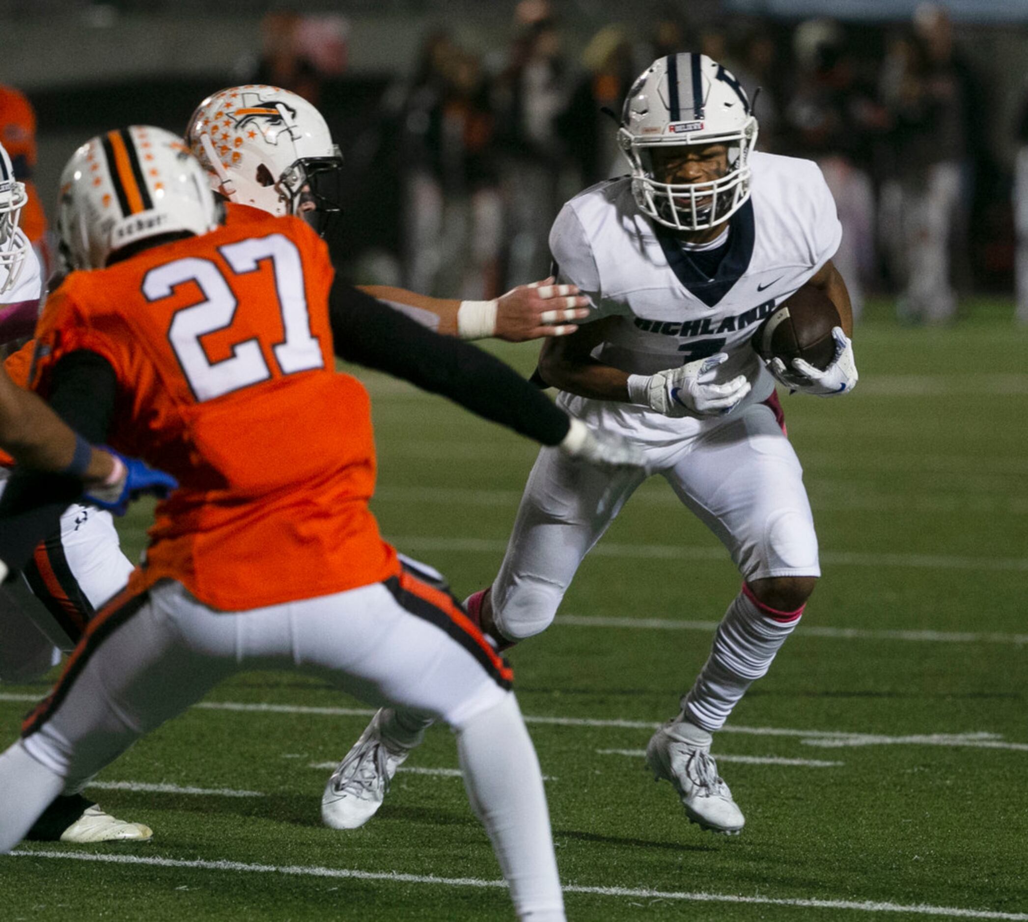 Richland's C.J. Nelson (1) tries to get past Haltom defenders during the first half of their...