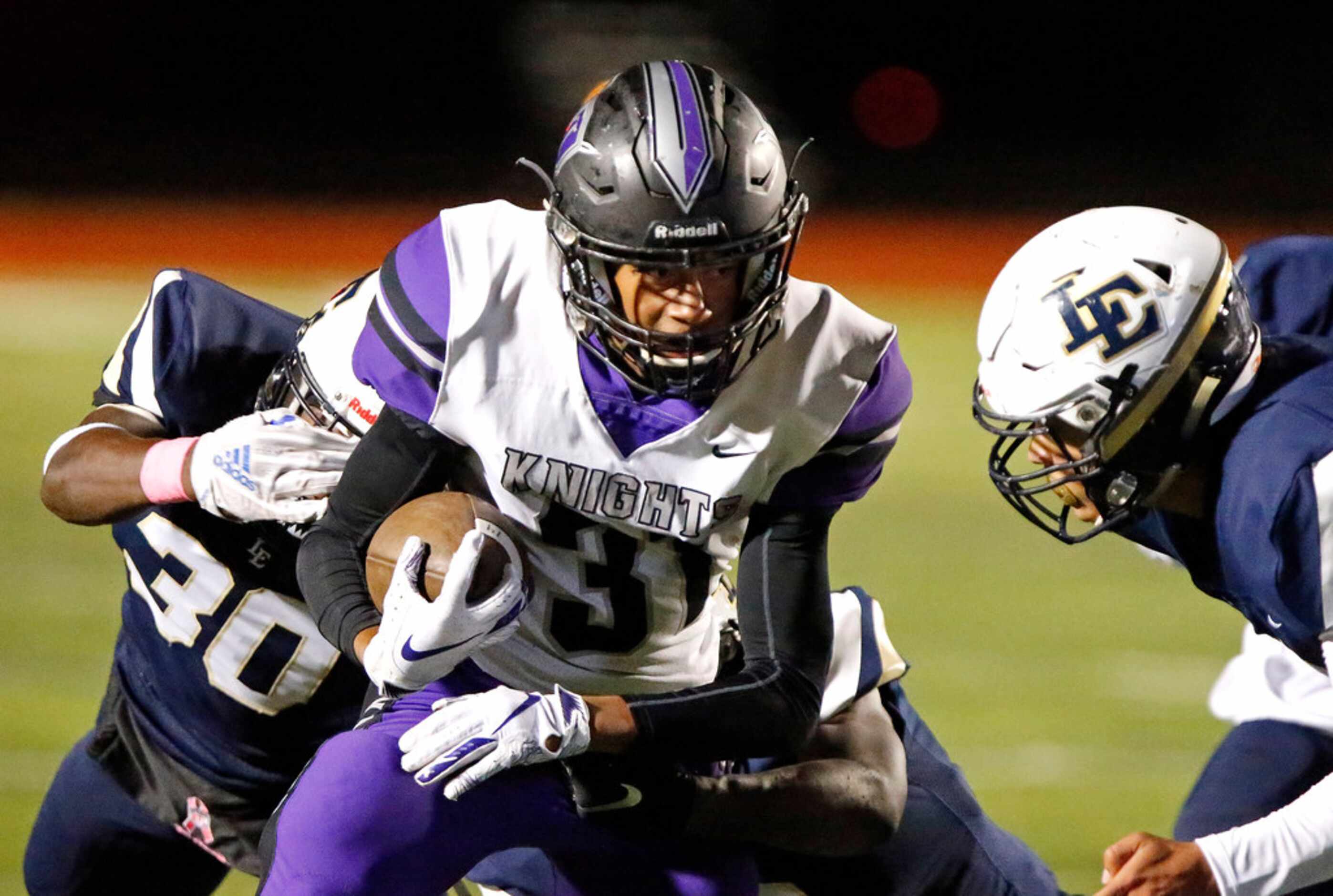 Independence High School running back Reggie Bush (31) gets past Little Elm High School...