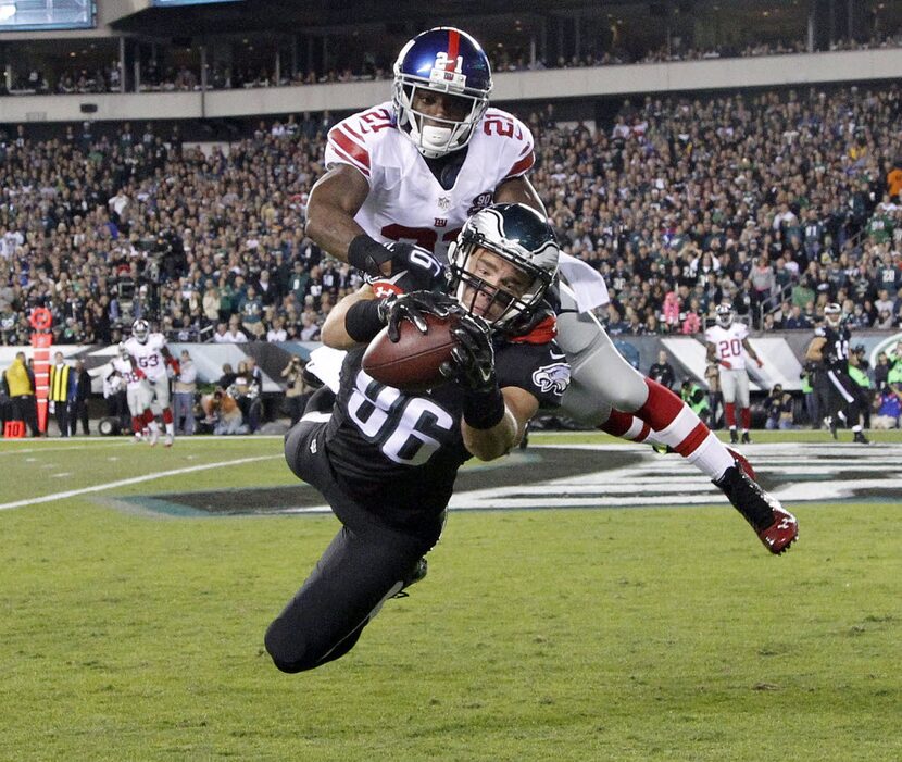 Philadelphia Eagles' Zach Ertz catches a touchdown pass past New York Giants' Dominique...