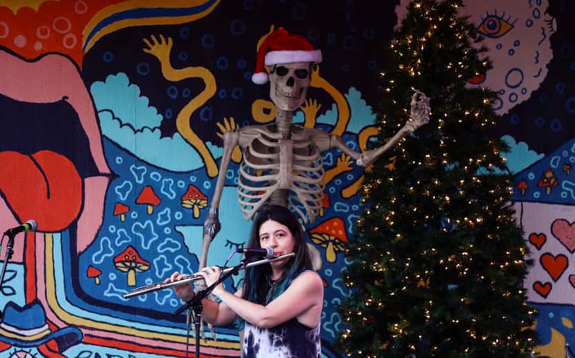 Tonya Blum plays the flute to psychedelic music at Dentonpalooza in Denton on Friday, Dec....