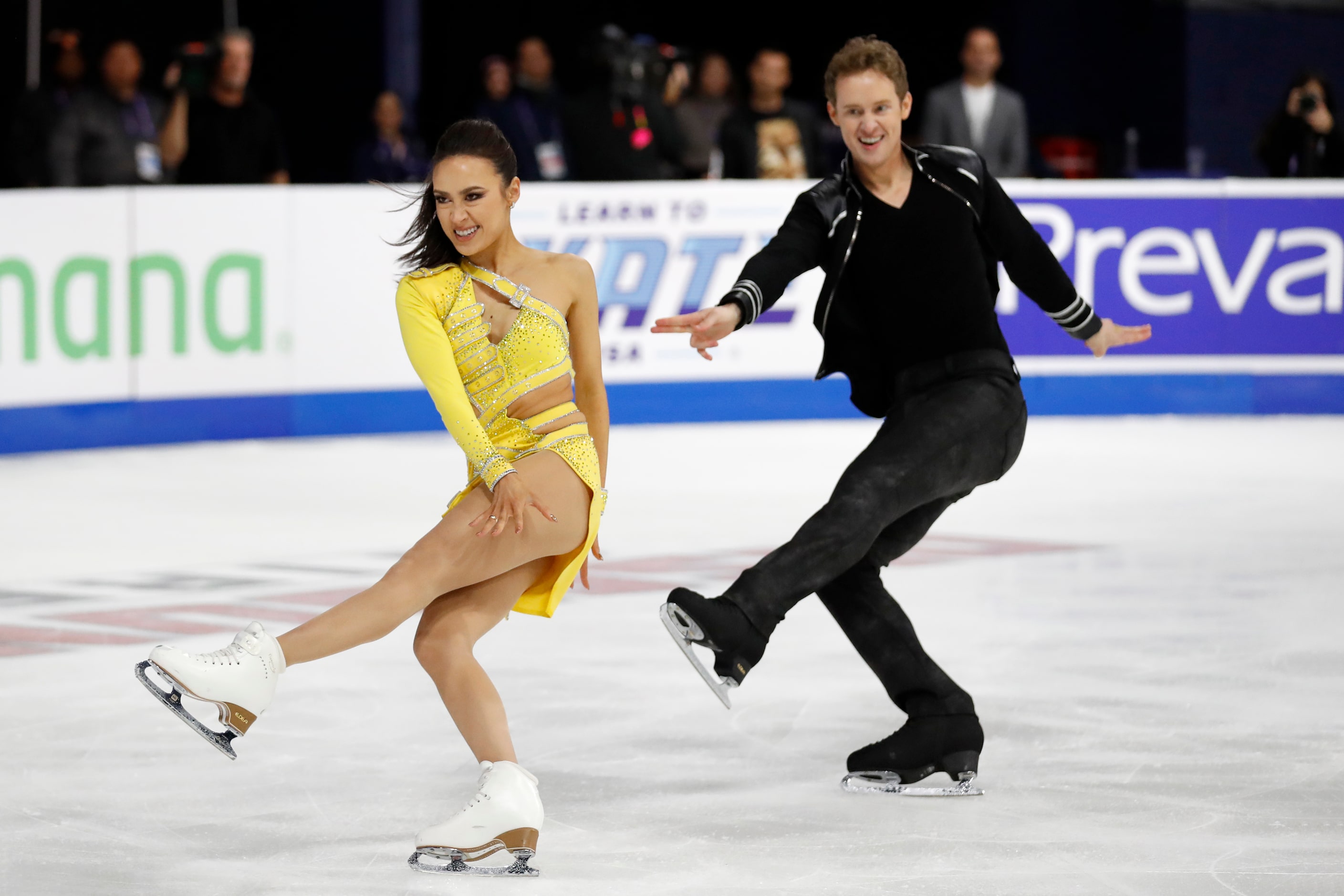 Madison Chock, left, and Evan Bates, of the United States, compete in the ice dance rhythm...