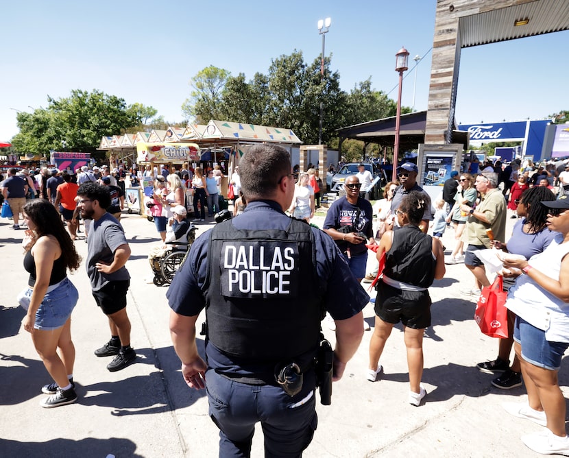 A Dallas Police officer scans the crowd at The State Fair of Texas in Dallas, TX, on Sep 27,...