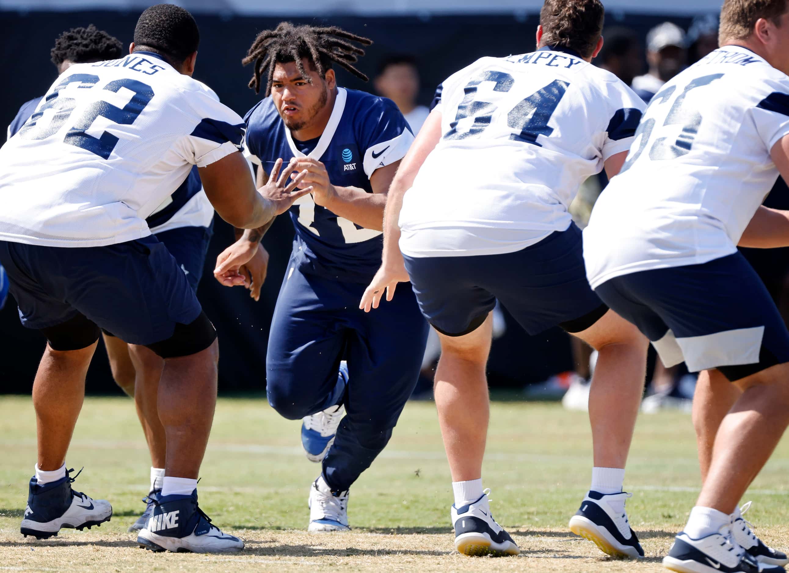 Dallas Cowboys defensive tackle Trysten Hill (72) rushes the offense during a mock game at...