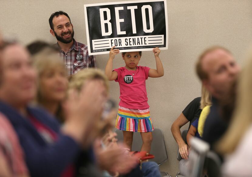 Alora Huebner, 5, holds up a sign during a rally for Beto O'Rourke, democratic nominee for...