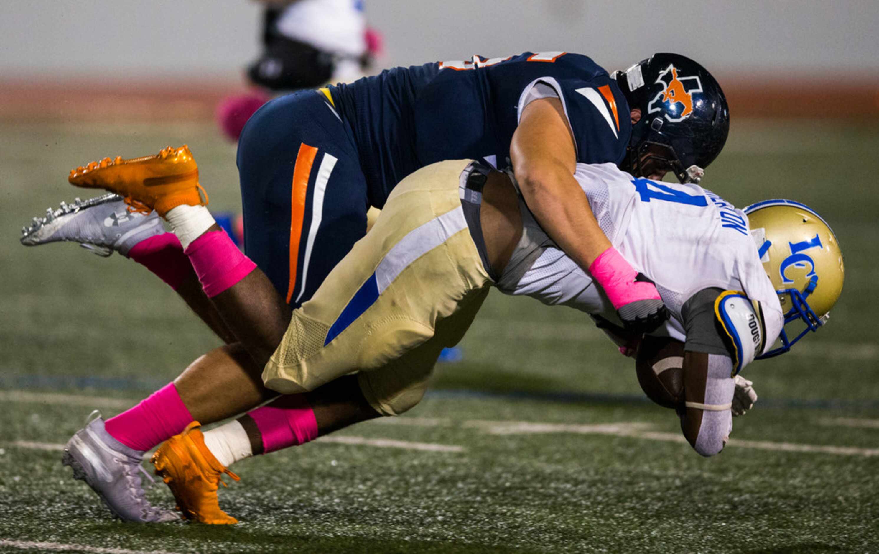 Garland Lakeview running back Camar Wheaton (4) is tackled by Sachse defensive lineman Ryan...