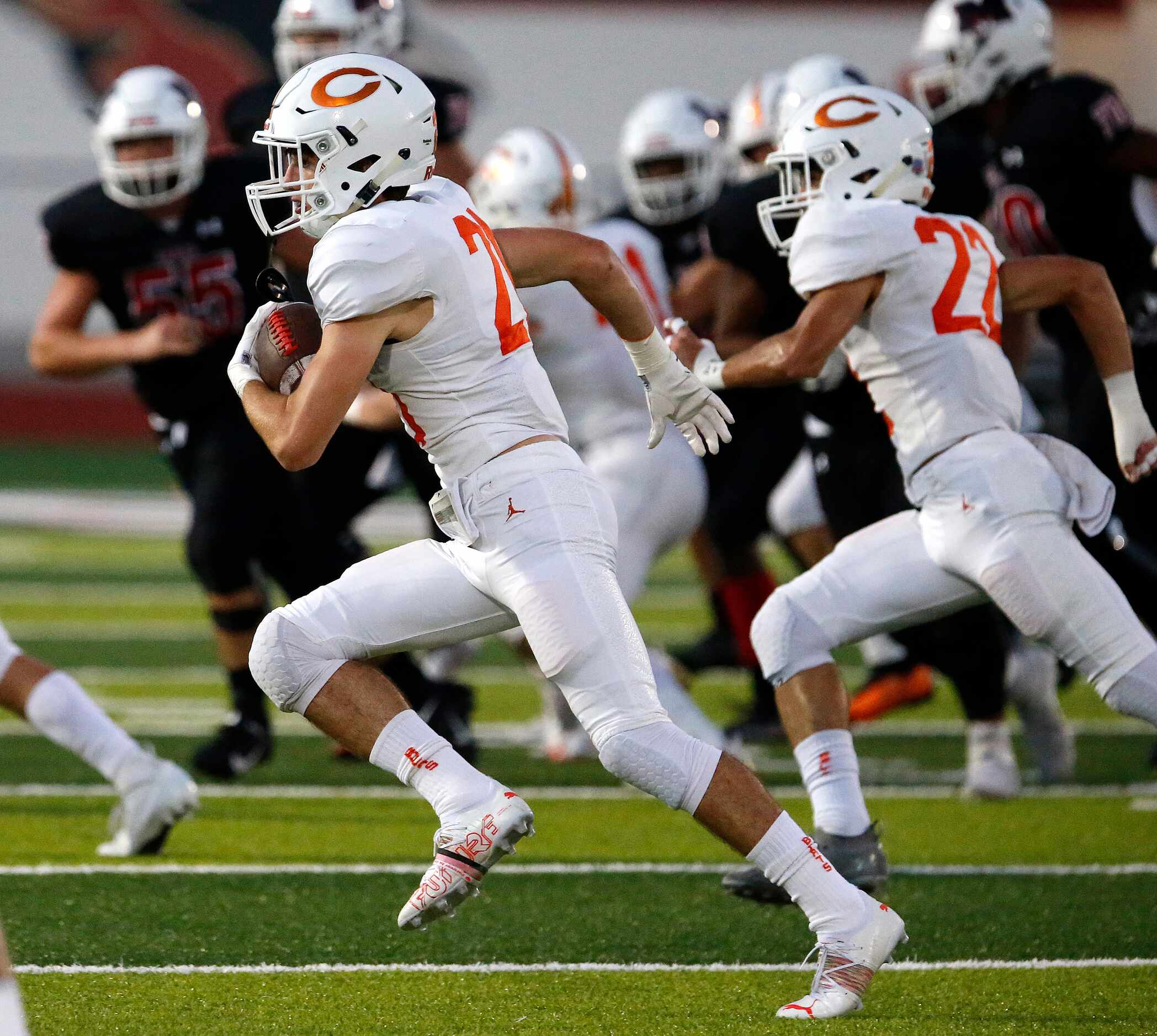 Celina High School wide receiver Joshua Defrank (21) gets yardage after the catch during the...