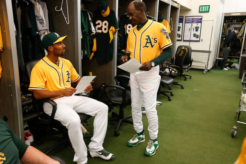 OAKLAND, CA - APRIL 5: Marcus Semien #10 and Third Base Coach Ron Washington #38 of the...