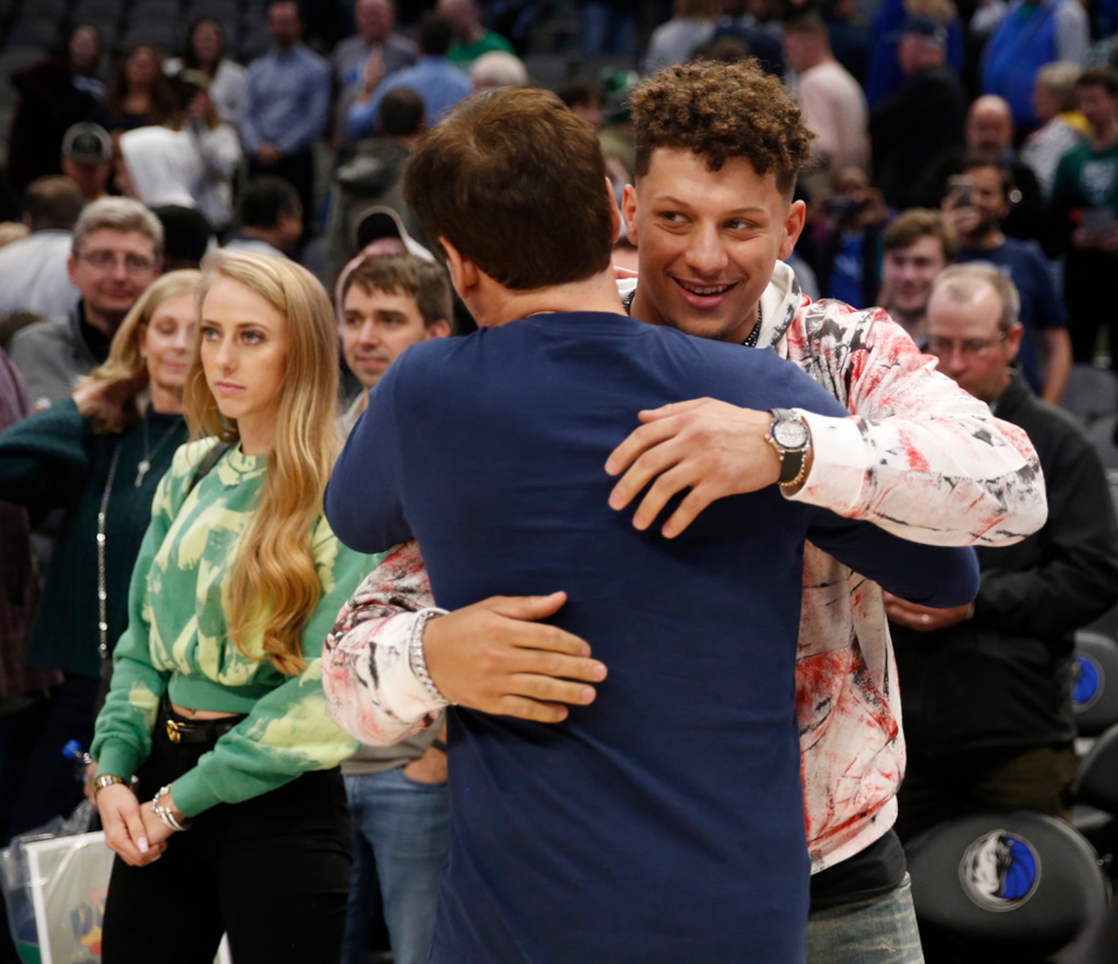 Dallas Mavericks owner Mark Cuban hugs Kansas City Chiefs quarterback Patrick Mahomes after...