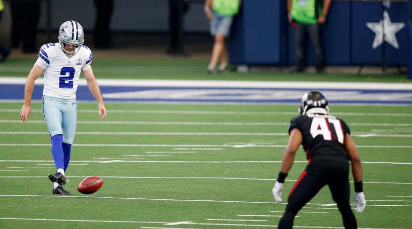 Dallas Cowboys kicker Greg Zuerlein (2) attempts an onside kick against the Atlanta Falcons...