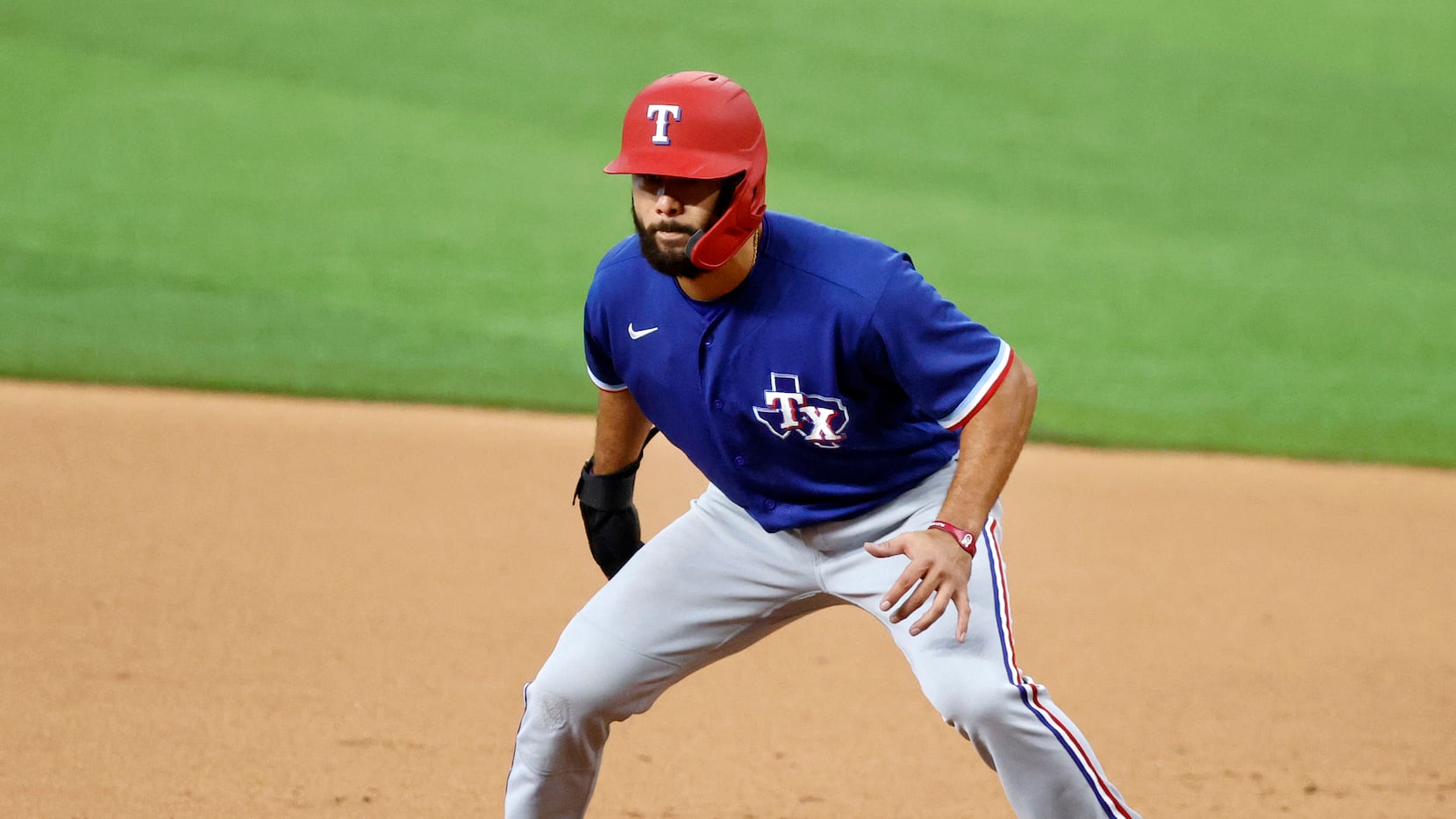 Texas Rangers infielder Isiah Kiner-Falefa takes a lead off during a simulated game at Texas...