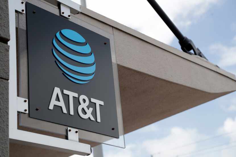 A sign is displayed at an AT&T retail store in Miami in this July 18, 2019 file photo.