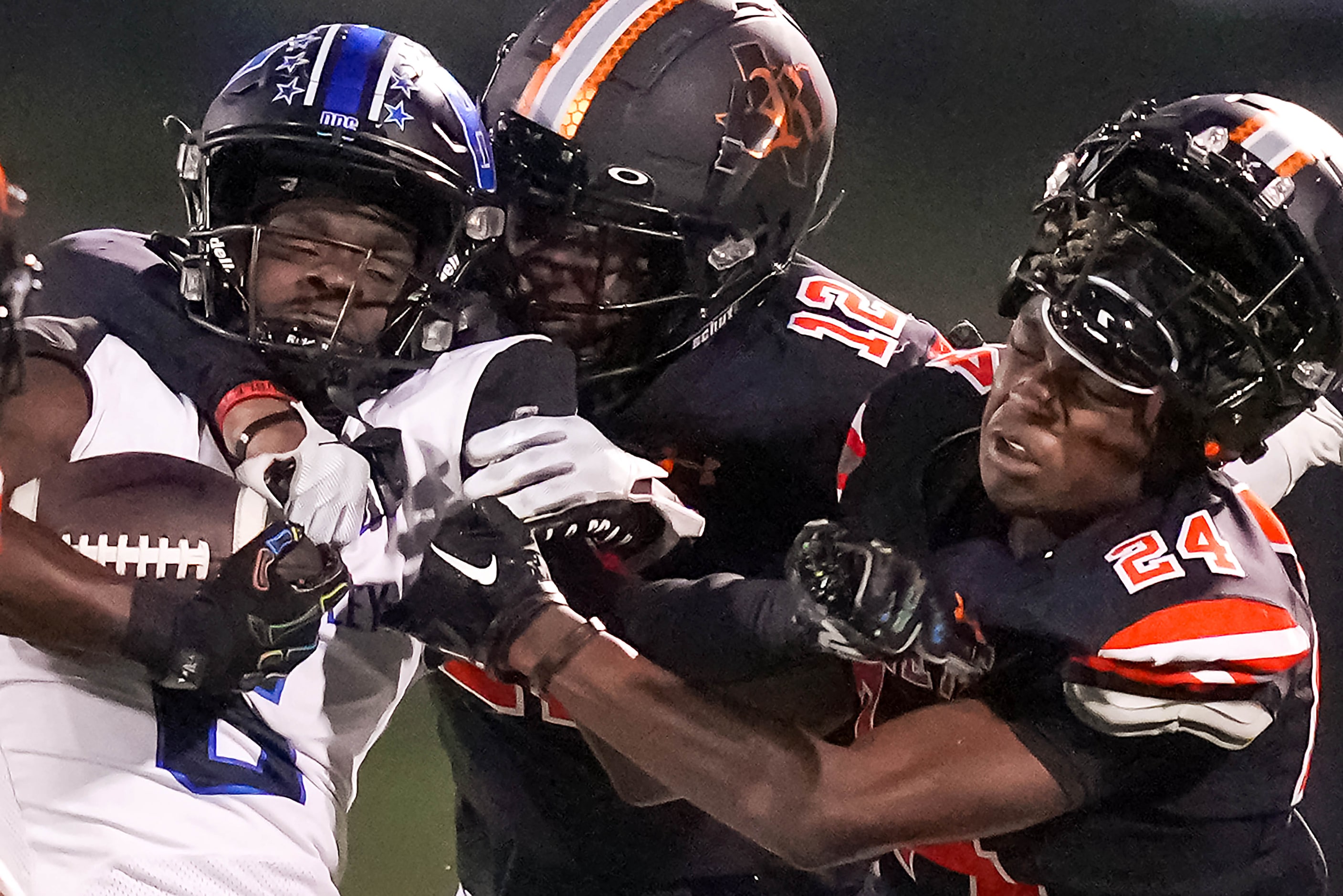 Rockwall defensive back AJ Brown (24) loses his helmet as he and defensive back Cameron...