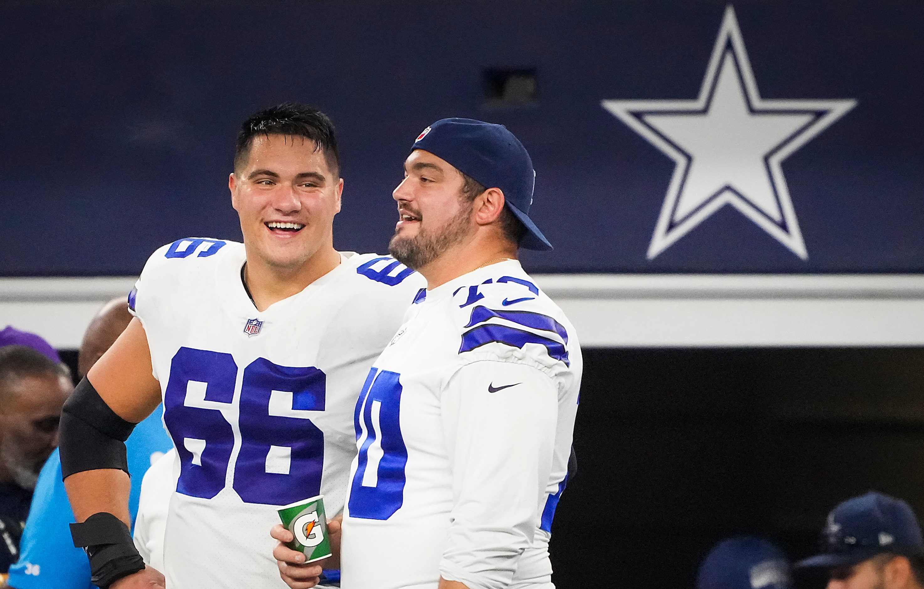 Dallas Cowboys guard Connor McGovern (66) talks with guard Zack Martin (70) on the sidelines...