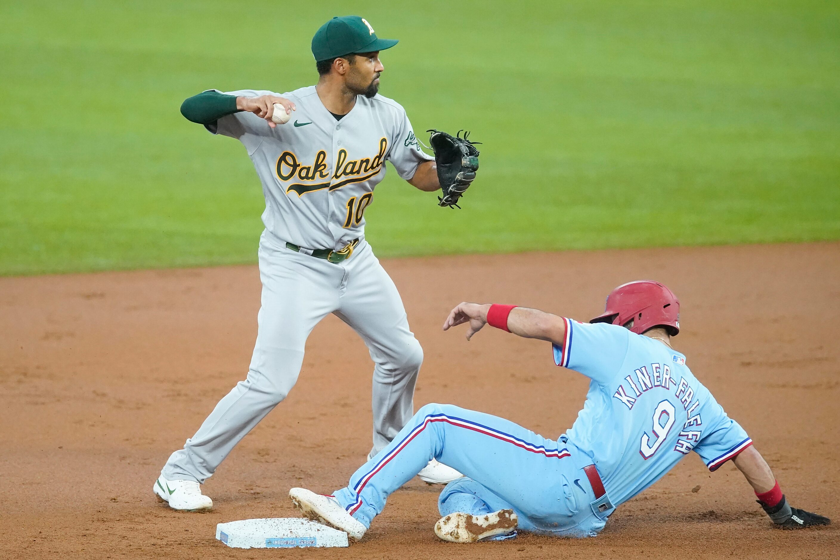 Oakland Athletics shortstop Marcus Semien makes the relay trying to turn a double play over...