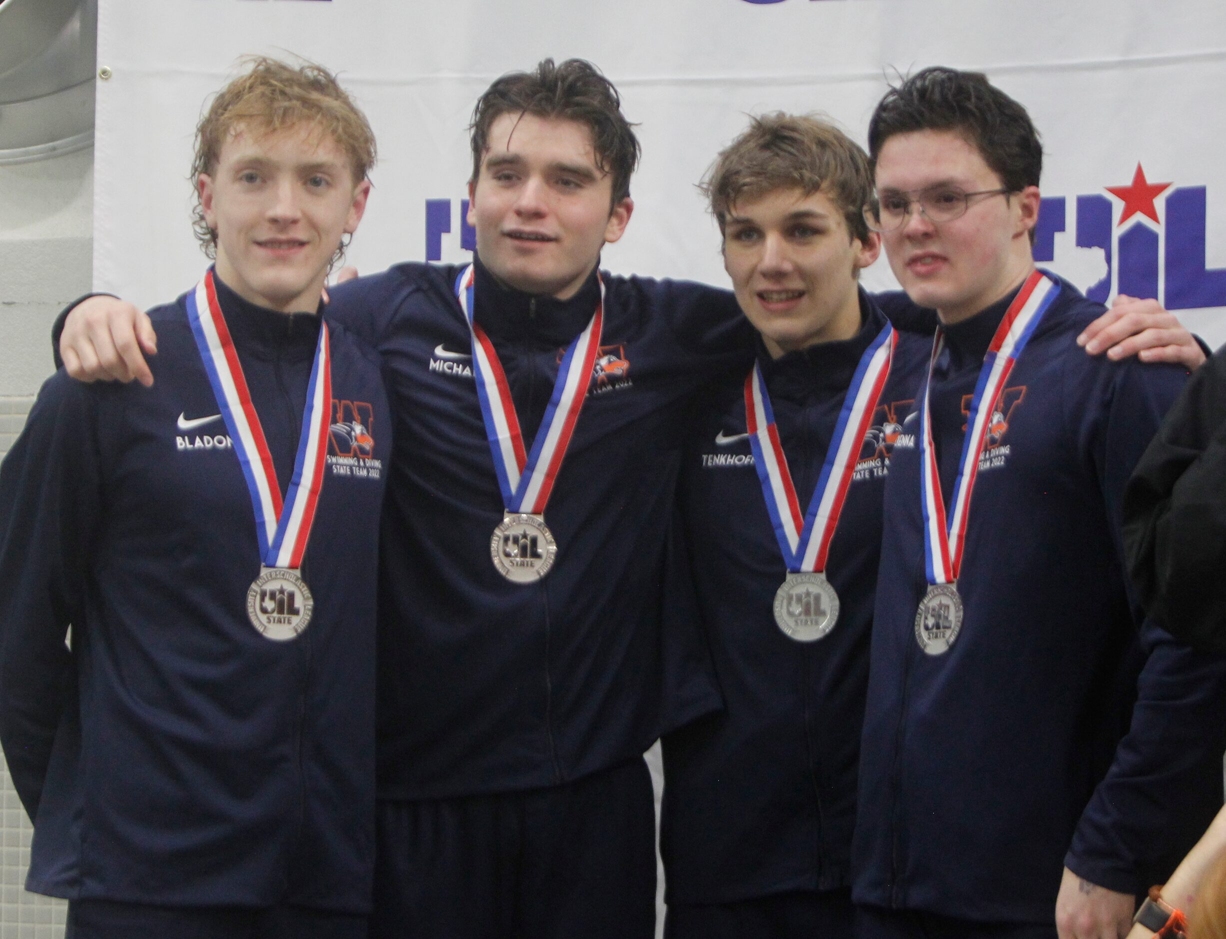 Members of the Frisco Wakeland swim team claim the silver medal in the 5A Boys overall...