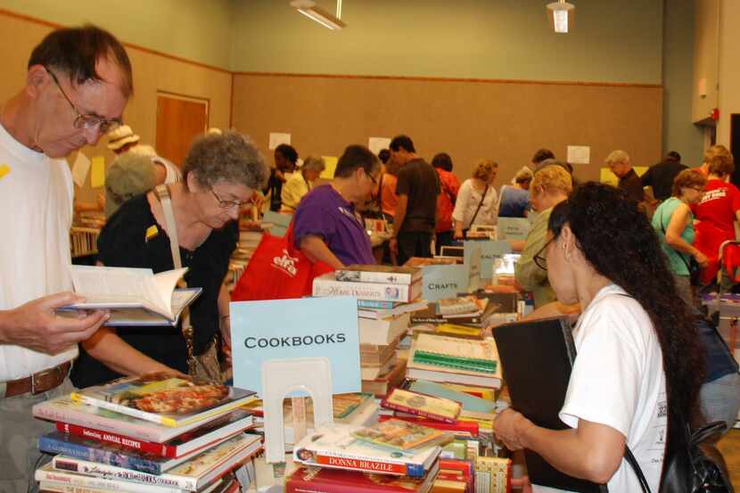People browse through gently used books at last year’s Lakewood Library Friends’ Annual Book...