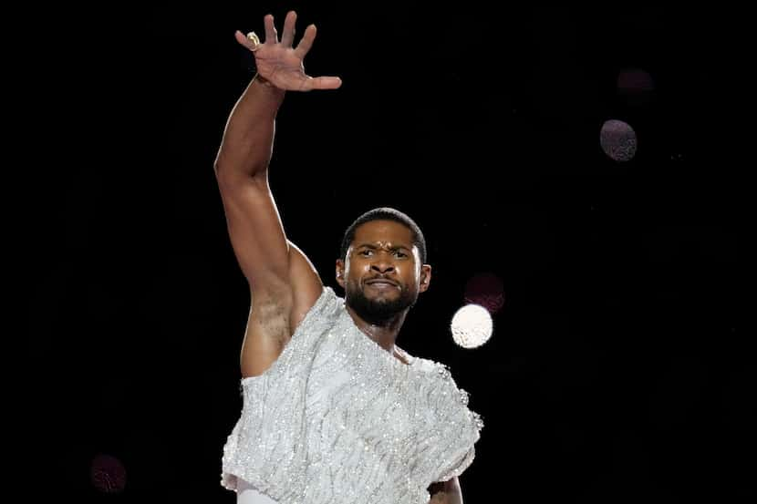 Usher performs during halftime of the NFL Super Bowl 58 football game between the San...