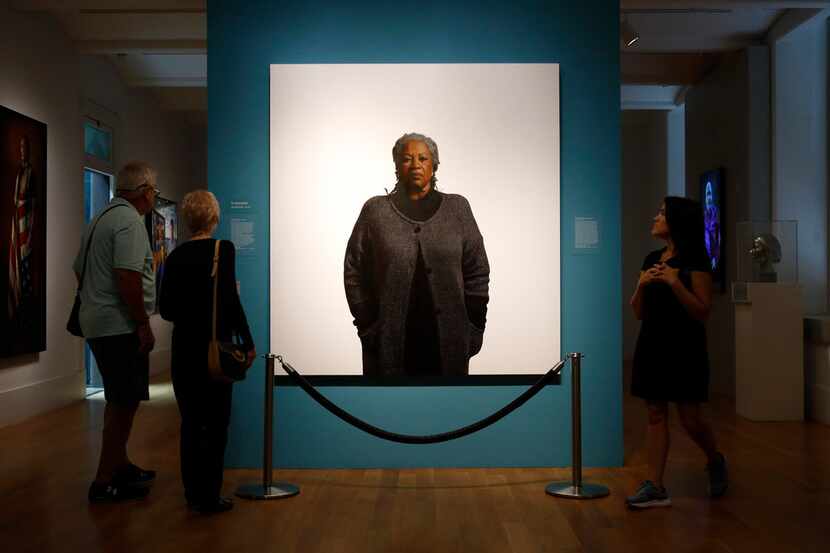 Visitors view a portrait of Toni Morrison by the artist Robert McCurdy, on Aug. 6, 2019, at...