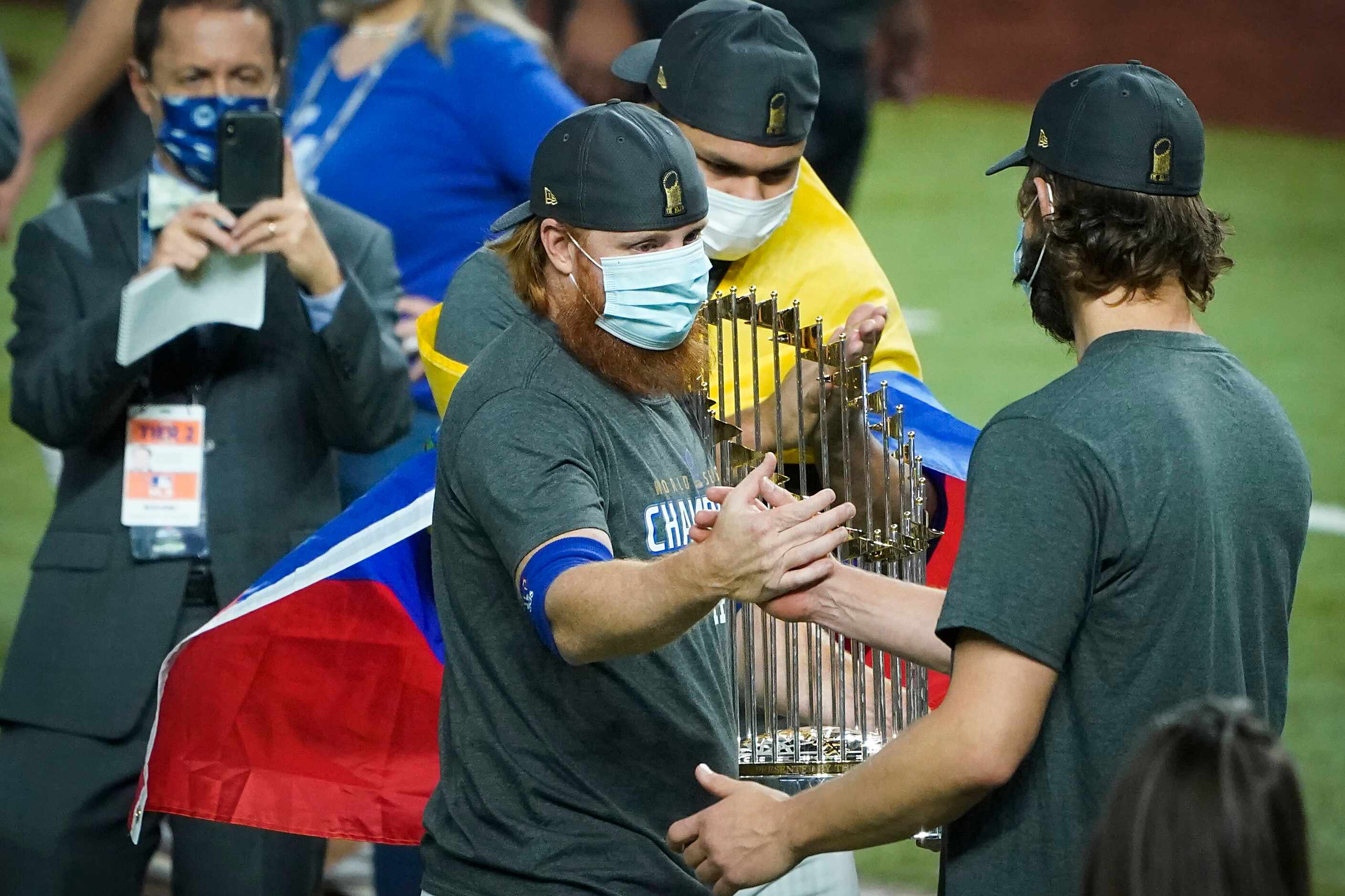 Los Angeles Dodgers third baseman Justin Turner (center) celebrates with starting pitcher...