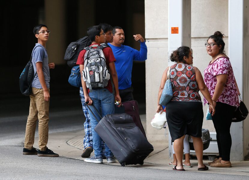 Evacuees from South Texas arrive at the "mega shelter" outside the Kay Bailey Hutchison...