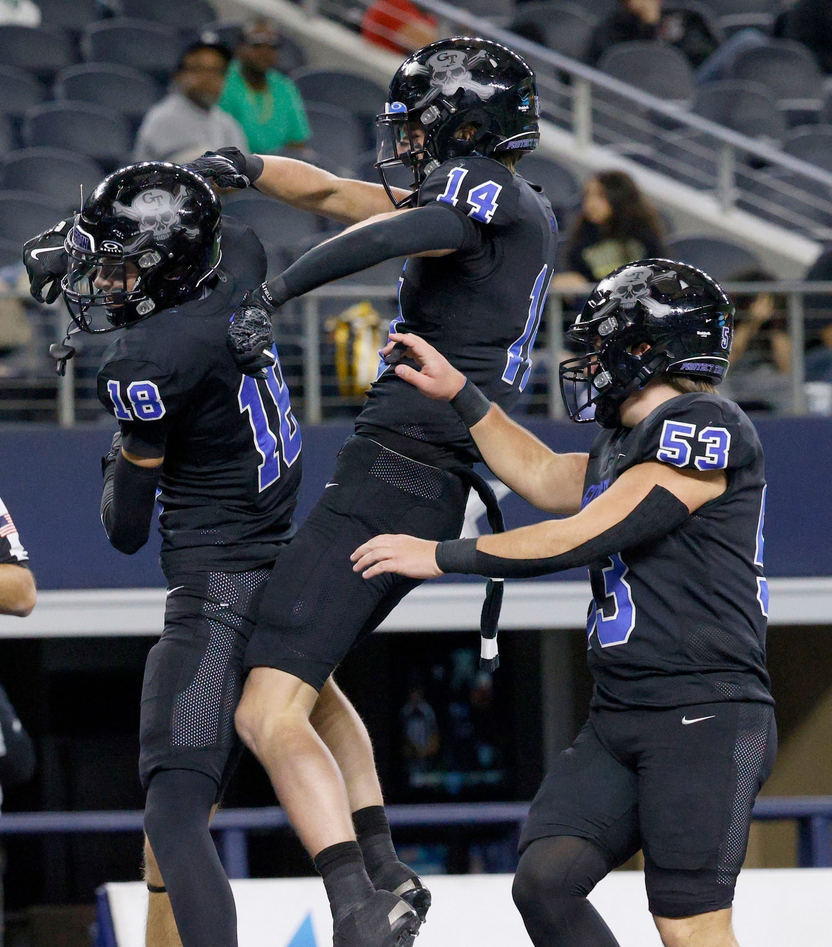 Gunter's  Cash Rumage (18) celebrates with his teammates Karson Williams (14) and Tate...