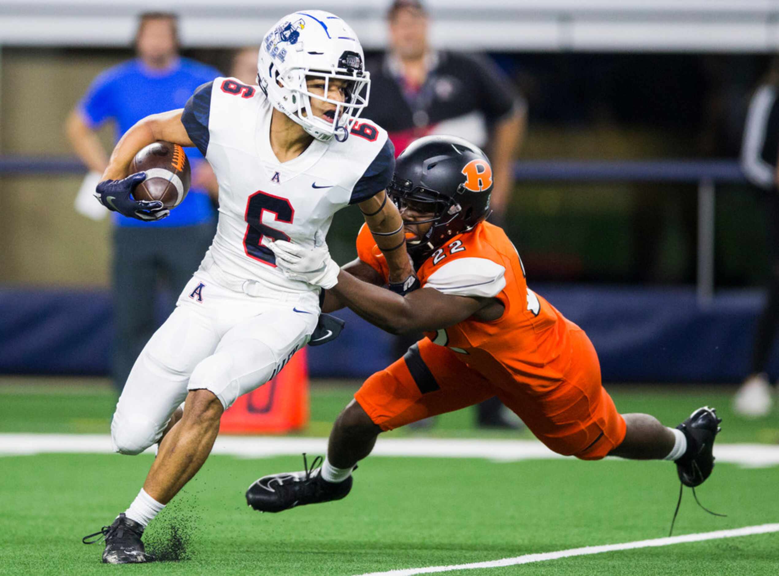 Allen defensive back Matthew Norman (6) is tackled by Rockwall wide receiver Goodnews...