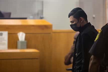Defendant Ruben Alvarado is escorted into the courtroom in his trial for the murder of...