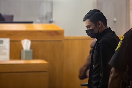 Defendant Ruben Alvarado is escorted into the courtroom in his trial for the murder of...