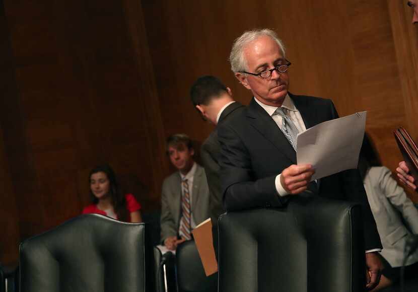 Sen. Bob Corker, R-Tenn., looked over his papers during a Senate Banking, Housing and Urban...