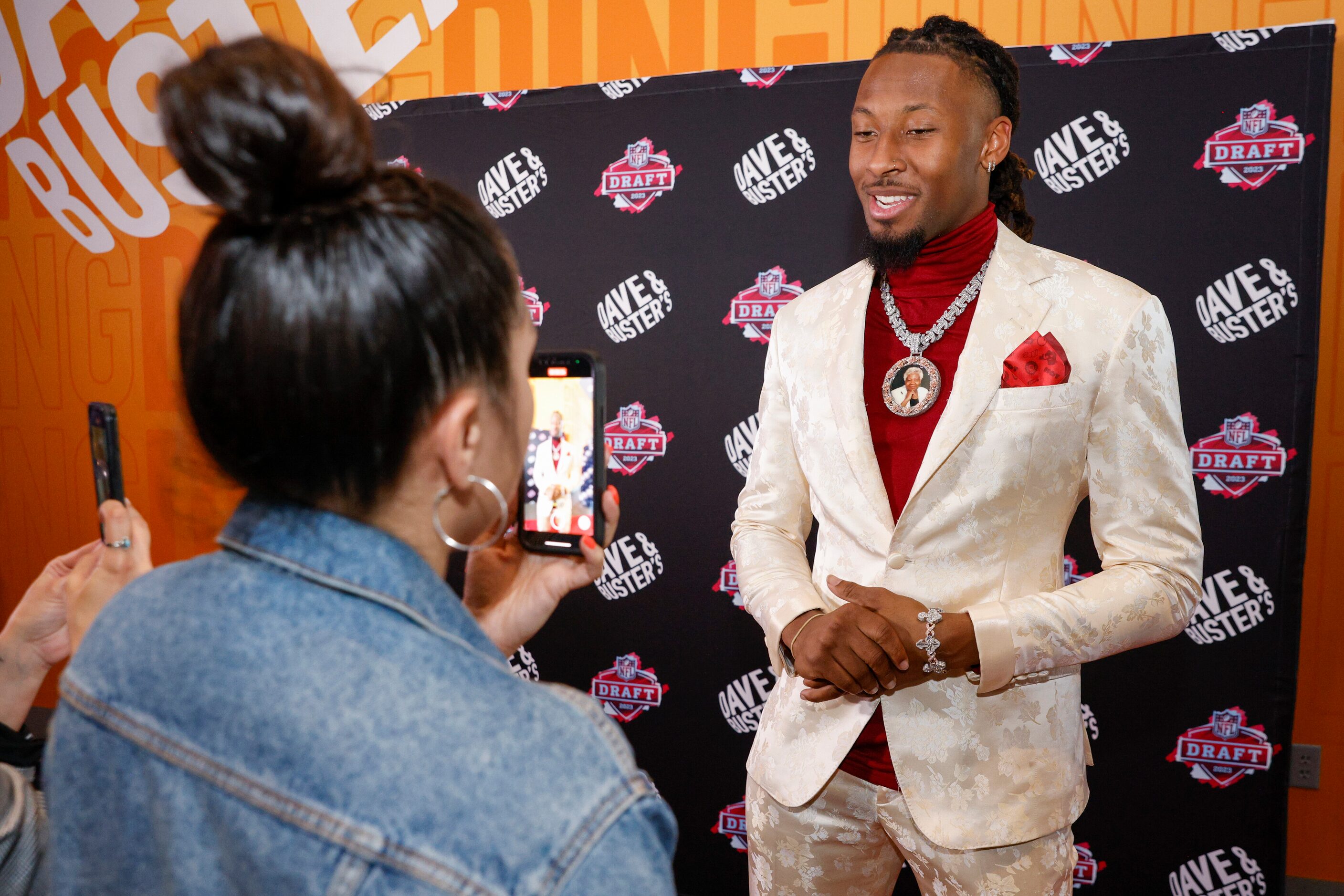 TCU wide receiver Quentin Johnston talks on the red carpet before a 2023 NFL Draft party at...