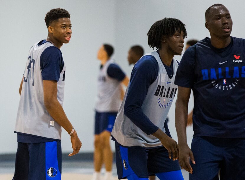 Mavericks forward Kostas Antetokounmpo (37, left) watches his teammates during a practice at...