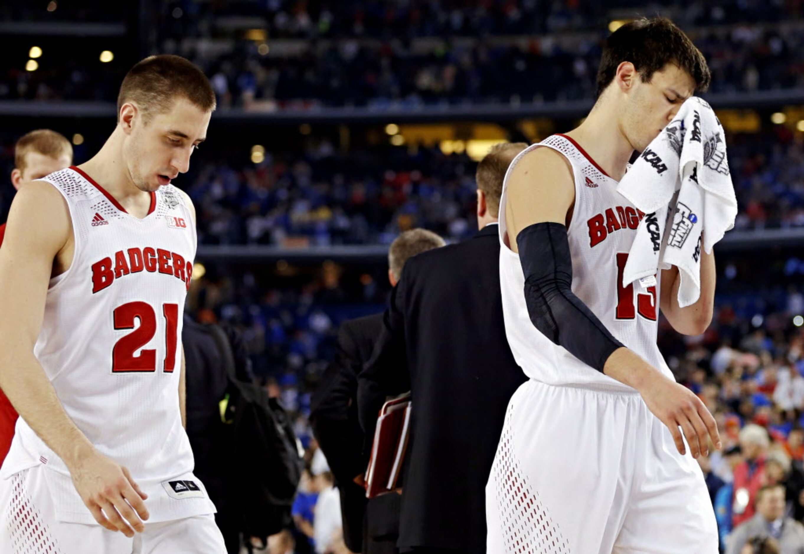 Wisconsin Badgers guard Josh Gasser (21) and forward Duje Dukan walks off the court after...