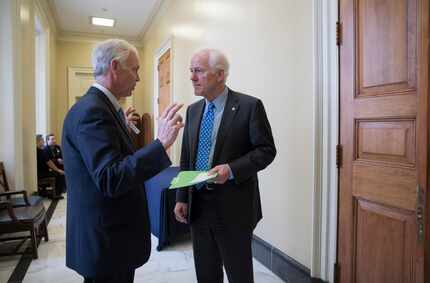 Sen. Ron Johnson, R-Wis., (left) chairman of the Senate Homeland Security and Governmental...