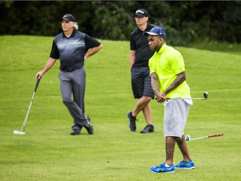 Dallas Cowboys running back Ryan Williams takes a shot on hole 18 during the Dallas Cowboys...