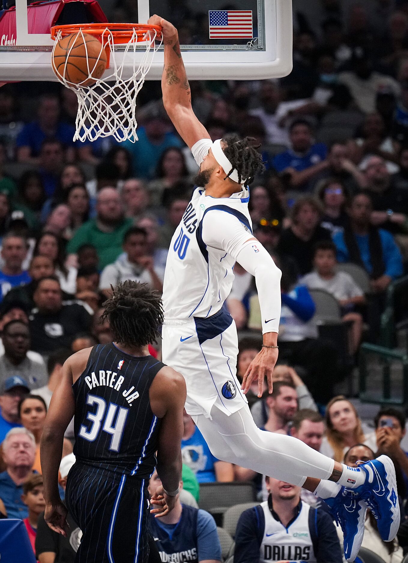 Dallas Mavericks center JaVale McGee (00) dunks the ball past Orlando Magic center Wendell...