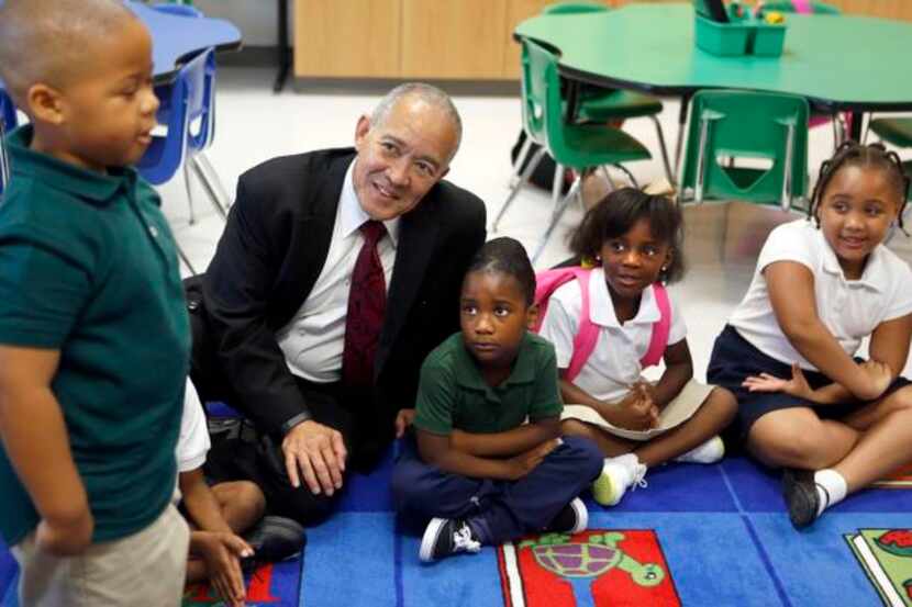 
Dallas ISD Superintendent Mike Miles and (from right) Trinity Morgan, C’Niya Phillips and...