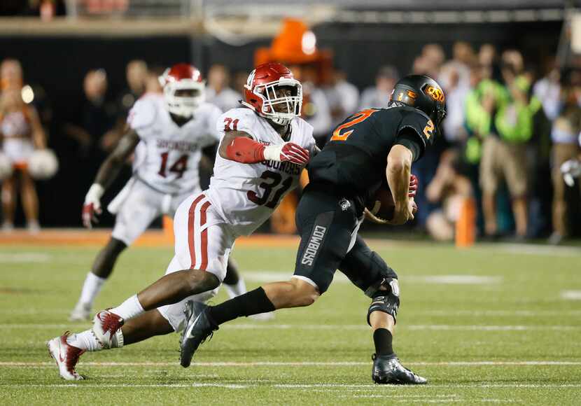 FILE - In this Nov. 4, 2017, file photo, Oklahoma defender Ogbonnia Okoronkwo (31) sacks...