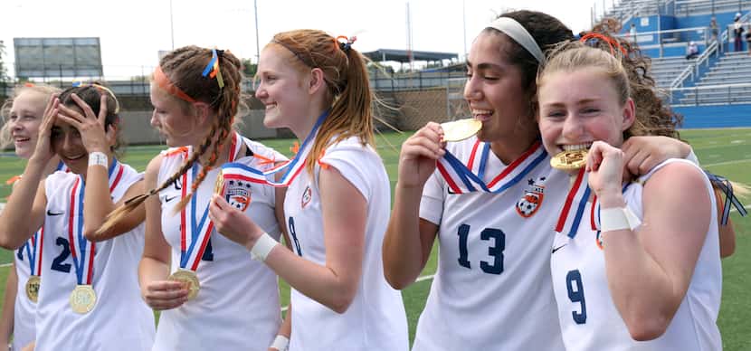 Frisco Wakeland's Dayleigh Bos (9), right, and Ana Carrera (13) show off their medals for...