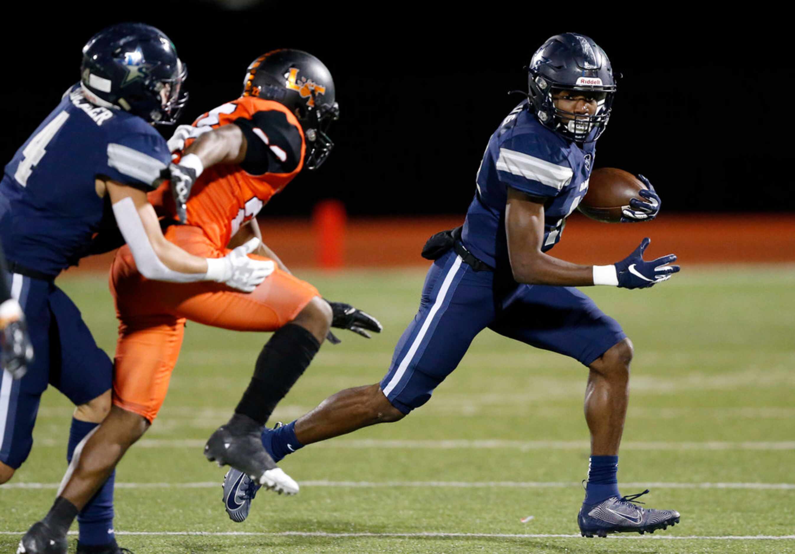 Frisco Lone Star wide receiver Marvin Mims (8) runs after a first quarter catch in the first...