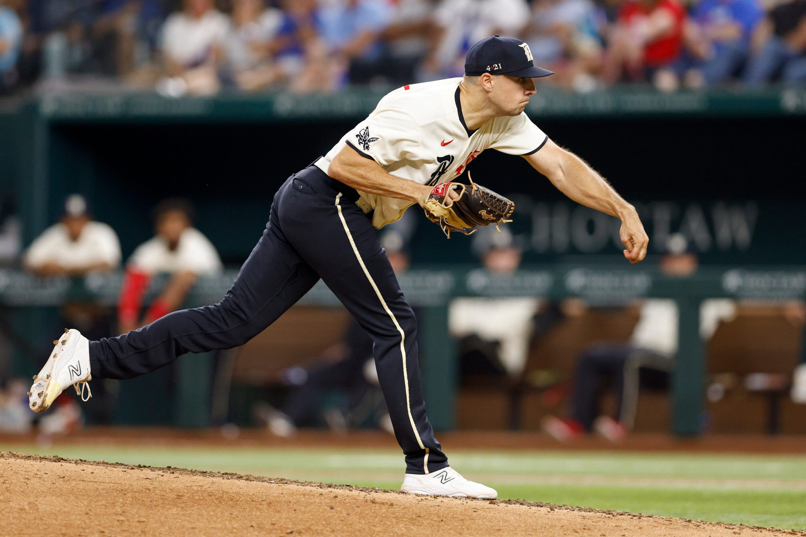 Texas Rangers relief pitcher Brock Burke (46) throws a pitch during the eighth inning of a...