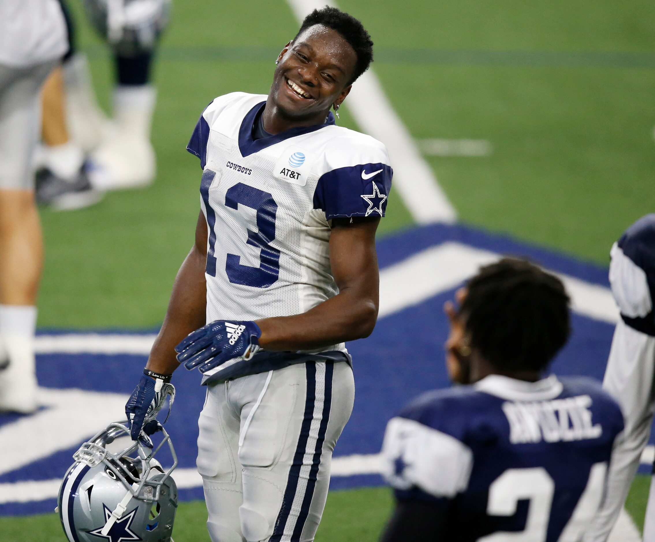 Dallas Cowboys wide receiver Michael Gallup (13) smiles during a break in practice during...