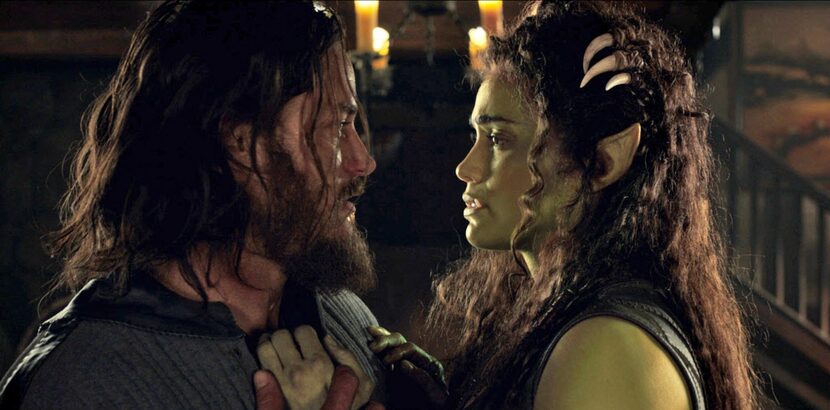 The implied romance between Lothar (Travis Fimmel, left) and Garona (Paula Patton) isn't...