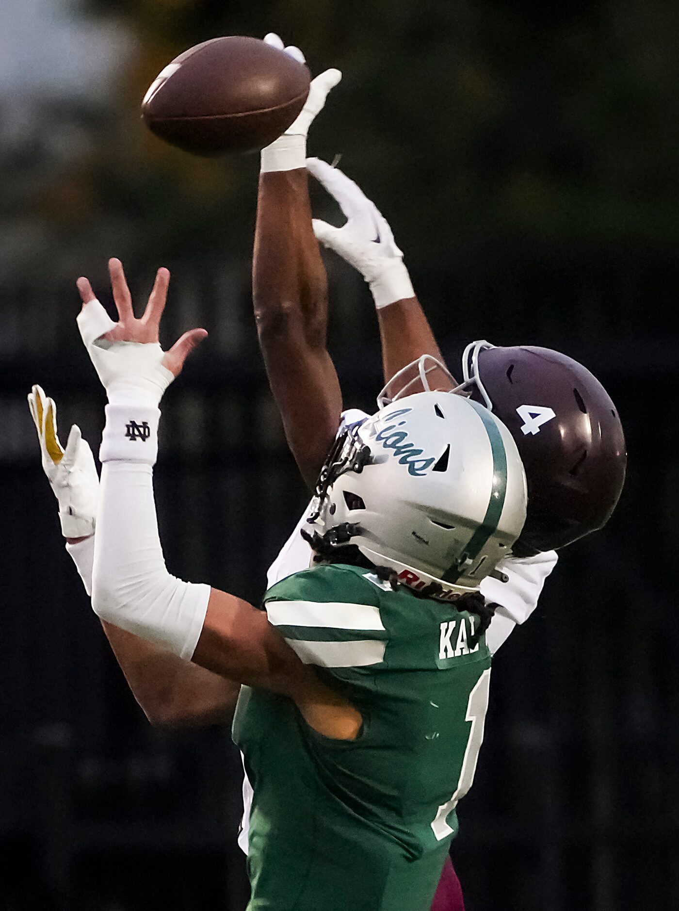 Mansfield Timberview defensive back Jon Smith (4) breaks up a pass intended for Frisco Reedy...