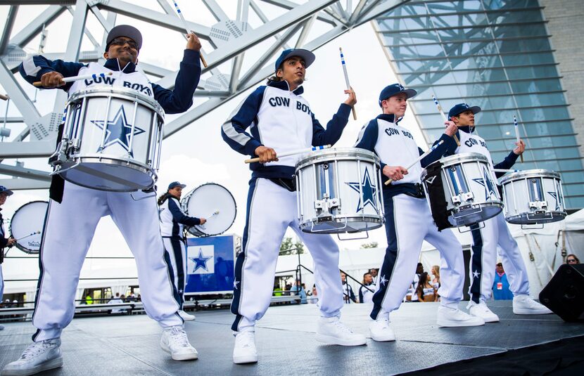 The Dallas Cowboys drumline performs before an NFL preseason game between the Dallas Cowboys...