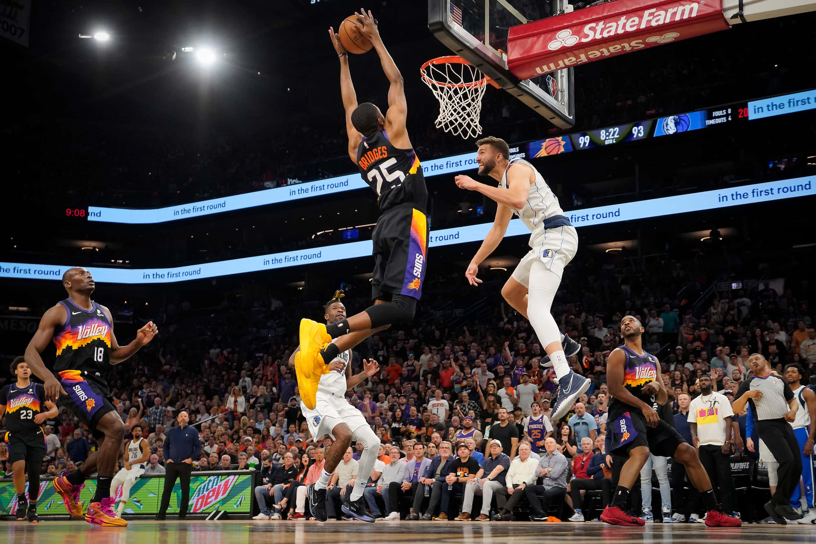 Phoenix Suns forward Mikal Bridges (25) dunks the ball on an alley oop from guard Chris Paul...