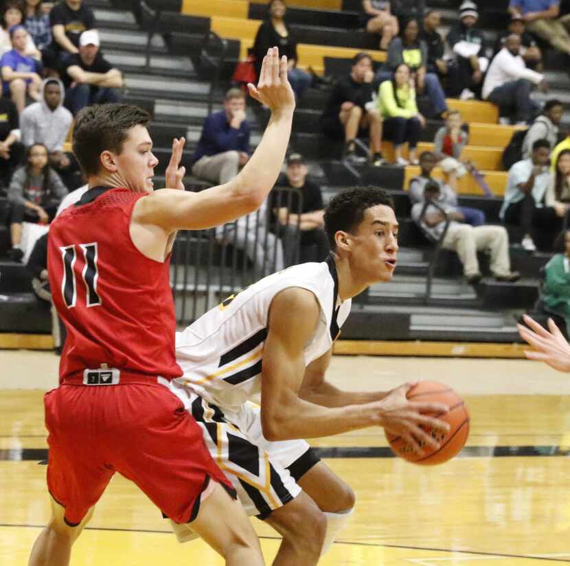 Flower Mound Marcus Jake Watermiller, #11 tries to prevent Plano East Marek Nelson during...