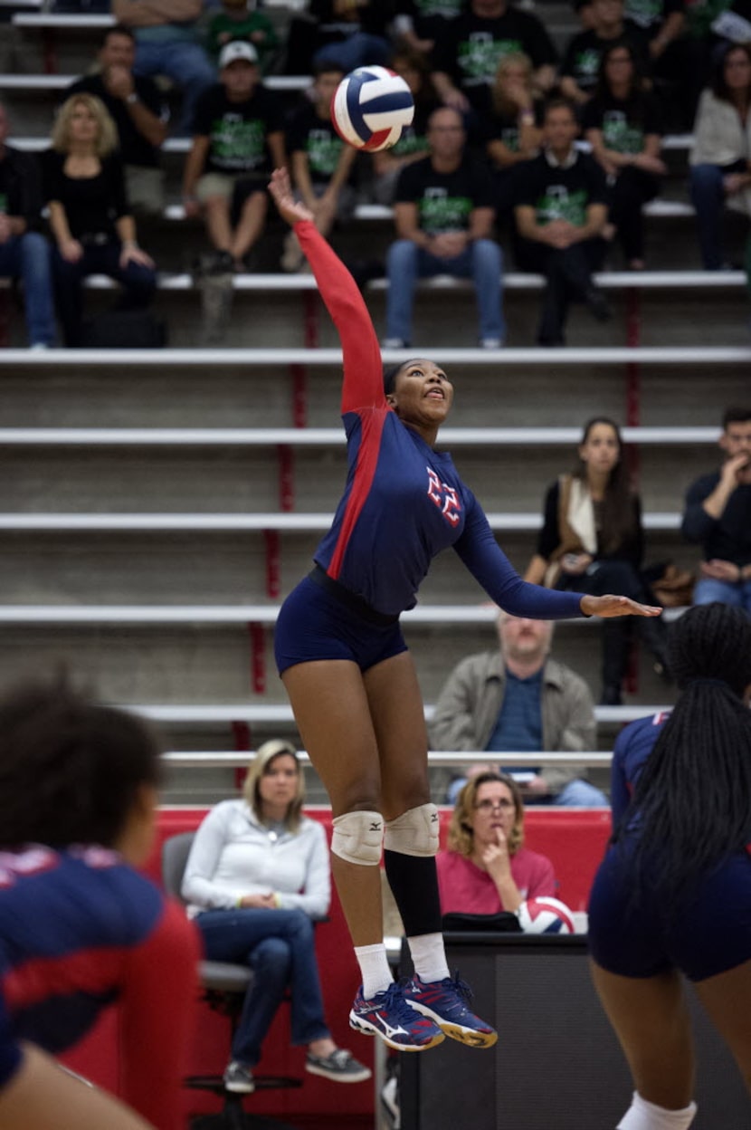 Allen senior outside hitter Chandler Atwood goes up for a hit against Southlake Carroll...