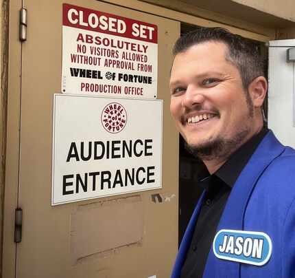 Jason White of Fort Worth stands outside the doors of the Sony Pictures Studios set in...