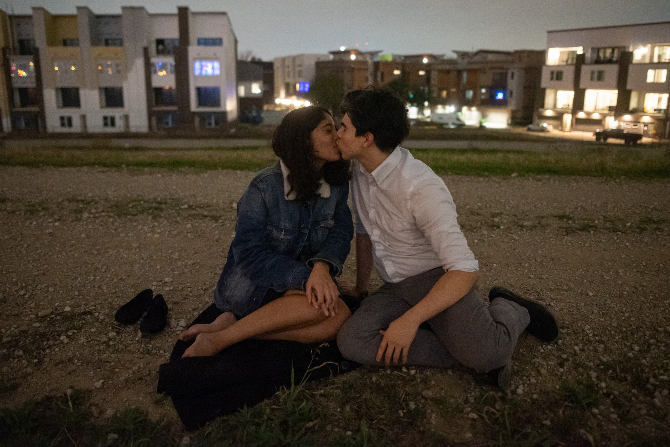 Brynetta Ransom, 23, left, and Kyler Ramos, 26, both of Carrollton, have their first kiss of...