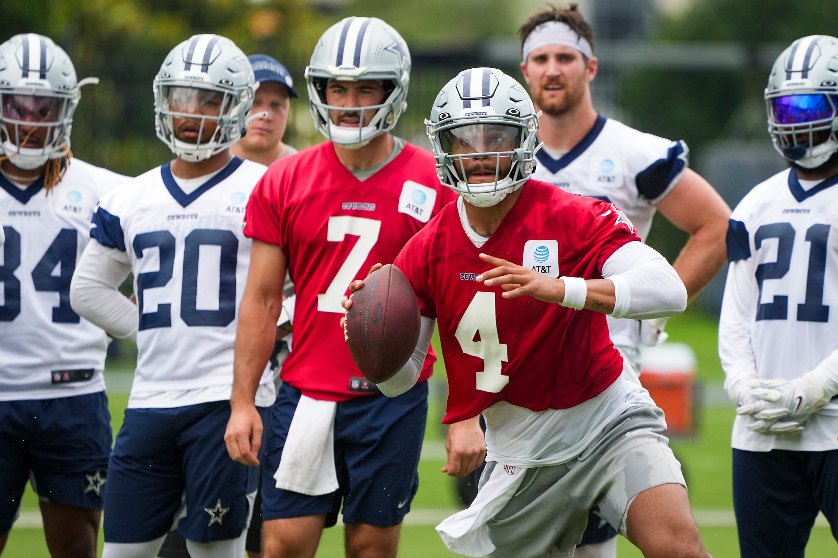 Dallas Cowboys quarterback Dak Prescott (4) scrambles in a drill during a minicamp practice...